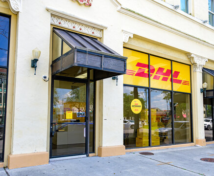 New Orleans, LA, USA - August 28, 2026: Shopfront to DHL Express Parcel Service on St. Charles Avenue in the Lower Garden District