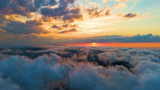 Aerial drone hyperlapse video of sea clouds during breathtaking sunset in Sinop, Black Sea region, Turkey. Stunning cinematic landscape with bright sun shining through colorful dramatic sky and cloud
