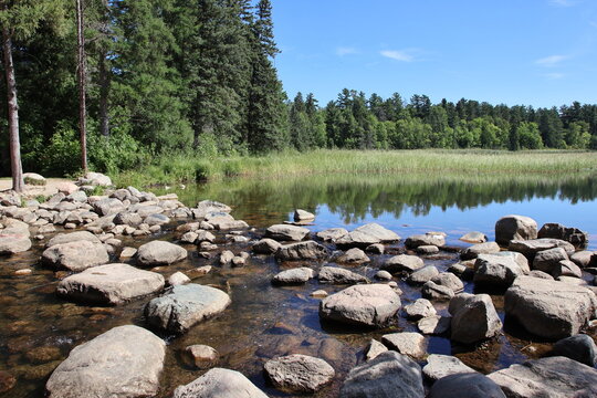 Lake Itasca and Mississippi River Headwaters at Itasca State Park Minnesota, Scenic Lake Itasca in Itasca State Park With Forest and Sunlit Water



