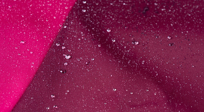 Waterproof fabric texture with rain drops closeup