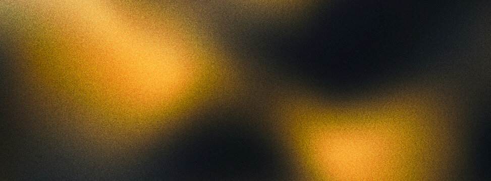 Abstract grainy gradient background with warm amber light. Soft blurred texture in orange and black tones. Moody atmospheric wallpaper for design.