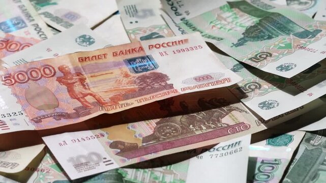 Paper banknotes of Russian rubles of different denominations in a stack close-up