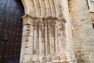 Carved stone details of The Romanesque Portal of the western facade of The Old Cathedral of Plasencia city © SoniaBonet