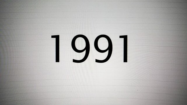 Capture: year 1991 being typed on a CRT monitor screen. A blinking cursor indicates text entry on a retro display. Represents vintage technology and historical data input.