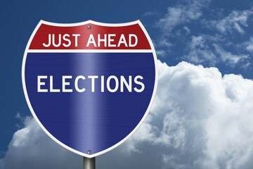 Elections Just Ahead text on an American interstate road sign with sky for voting © Karen Roach