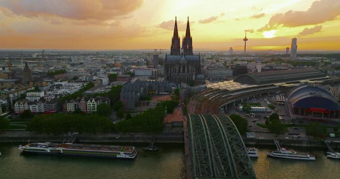 Aerial view of the city of Cologne, featuring Cologne Cathedral at a beautiful sunset
