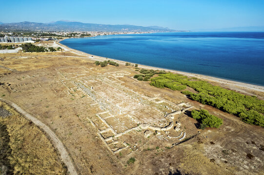 Aerial view of the Early Christian Basilica of Saint Leonidis at Lechaion, Corinthia, Greece, showing the nave, apse, excavated foundations and Gulf of Corinth coast.