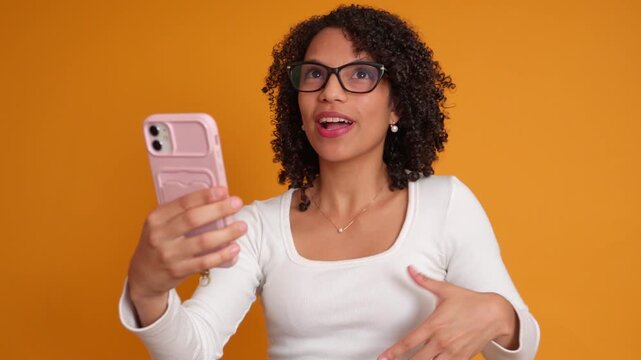 Black woman expressing multiple emotions during video call
