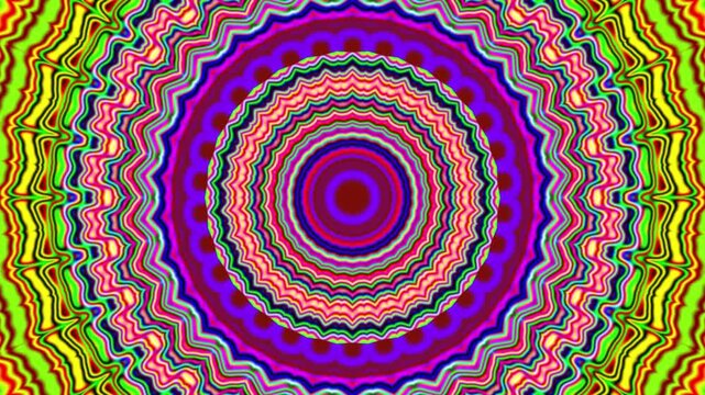 Vibrant mandala pulses with layered colors. Zigzag and wavy patterns form concentric rings