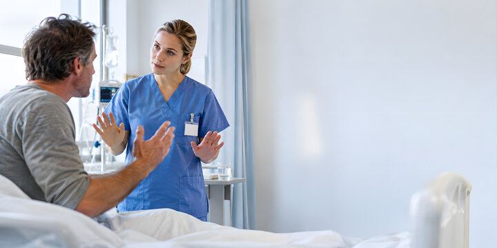 Nurse calmly de-escalating an upset patient in a modern hospital, illustrating healthcare conflict resolution, communication, empathy and professional patient care.
