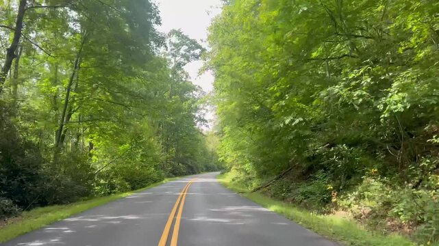 Driving along the scenic and popular Blue Ridge Parkway in the mountains of North Carolina near the town of Blowing Rock. 