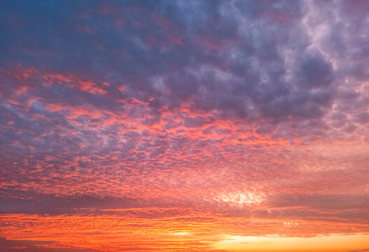 Vibrant Sunset Sky with Colorful Clouds in Shades of Orange and Purple