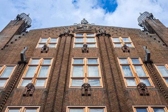 Ornate brick facade of the historic Shipping House (Scheepvaarthuis). It currently houses a Grand Hotel Amrath Amsterdam. Amsterdam, The Netherland. September 12, 2026.