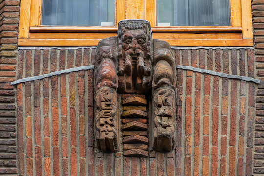 Ornate brick facade of the historic Shipping House (Scheepvaarthuis). It currently houses a Grand Hotel Amrath Amsterdam. Amsterdam, The Netherland. September 12, 2026.