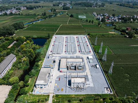 aerial view of large scale energy storage power station in rural farmland