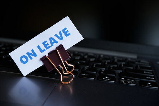 On Leave, annual leave for employees. An "ON LEAVE" sign with a paperclip resting on a keyboard. A break from work. Vacation, family event.