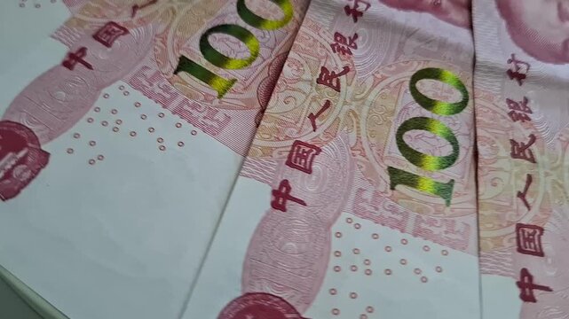 Chinese one hundred yuan banknotes stacked together close up. chinese currency, paper money, financial wealth, rmb cash.