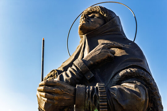 Bronze monument of Boyaryna Morozova in Borovsk, displaying the traditional two-finger prayer gesture, set against a clear summer sky: Russia - August 5, 2026