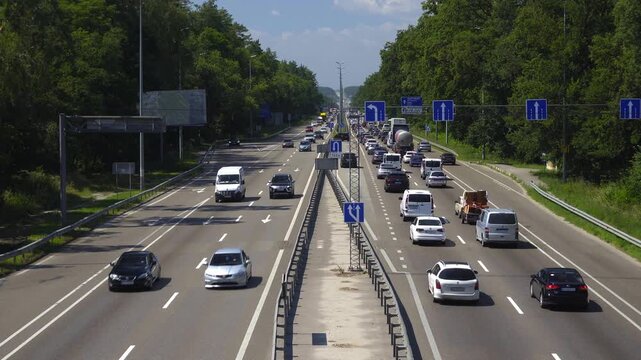 Busy Highway Traffic During Daytime Rush Hour With Congested Lanes and Moving Cars Vehicles 