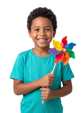 Happy young boy holding a colorful pinwheel toy against a white background isolated on white background