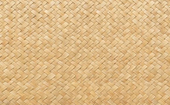 Woven bamboo mat texture background natural wicker pattern closeup organic material