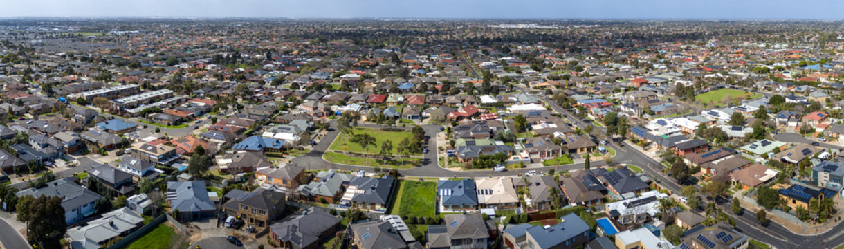 Expansive aerial panoramic view of established residential neighborhoods with rooftops&nbsp;local parks, and connected street grids across&nbsp;Tarneit in outer west Melbourne, Victoria, Australia