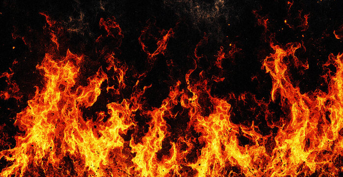 Bright orange and yellow flames burning intensely against a solid black background