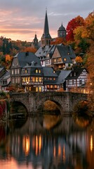 Obraz premium a picturesque European town nestled amidst a forest during autumn. The town features traditional halftimbered houses with dark roofs and white and brown facades, illuminated by warm.