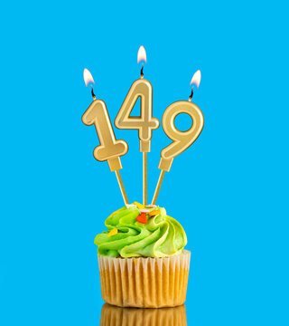 Birthday cupcake with candle number 149 - Blue background