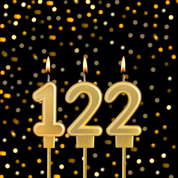 Number 122 on a black background with blurred lights - Birthday card with abstract blurred lights that glow
