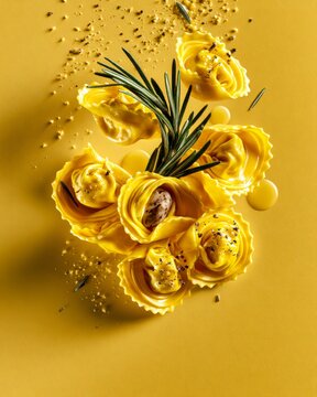 Handmade saffron cappelletti pasta with braised rabbit filling and rosemary butter, luxury chef tasting menu presentation, gourmet Italian fine dining, copy space.