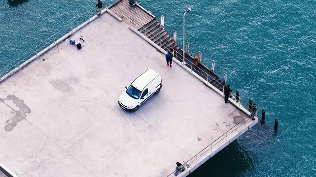 Aerial View of White Van Parked on Concrete Ocean Pier