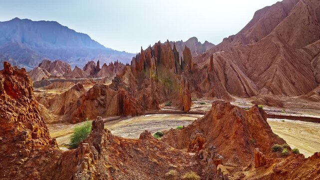 Aerial view of sharp sandstone ridges and deep canyons in the Red Mountain Stone Forest, Kuqa, Xinjiang, China