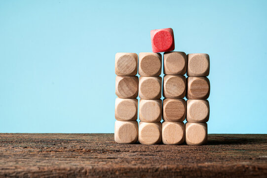 Wooden Blocks Stacked in a Unique Pattern on a Rustic Surface