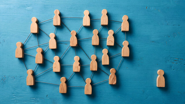 Social network of wooden figures connected by strings with one isolated person peg on blue background representing community and exclusion