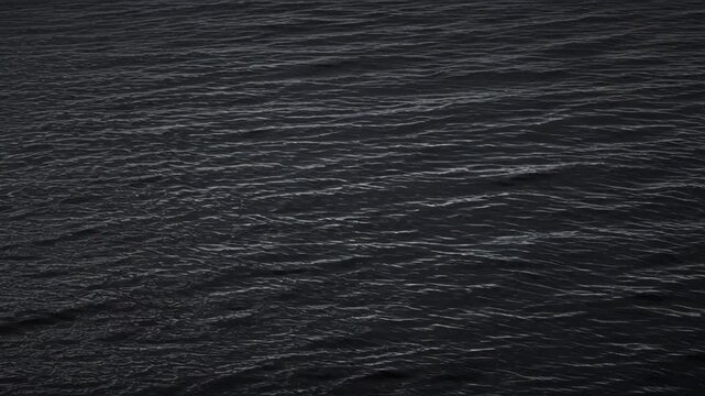 Dark Sea Surface with Gentle Wave Texture, Black Water Reflection, Moody Abstract Background, Tranquil Coastal Pattern, Atmospheric Natural Design and Calm Aquatic Visual for SEO Friendly Creative