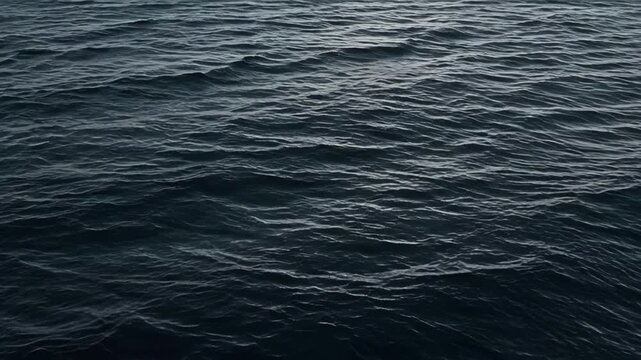 Dark Black Blue Ocean Sea Surface Wave Water Texture Creating Calm Abstract Marine Background with Moody Natural Rippled Patterns for Coastal Design and Ocean Themed Concepts