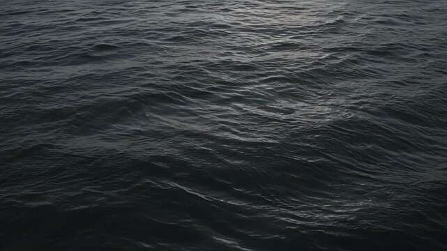 Dark Sea Surface with Gentle Wave Ripple Texture, Moody Ocean Water Background, Natural Marine Pattern and Calm Subdued Water Movement for Atmospheric Design