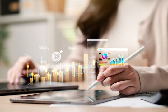 Finance business investment data analysis and stock market trading. Woman hands holding stylus pen using tablet with chart and graph.