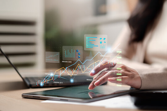 Finance business investment data analysis and stock market trading. Woman hand touching tablet screen with chart and graph.
