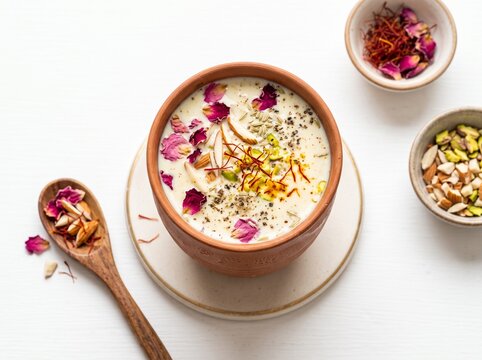 Traditional Indian milk drink flavored with saffron and almonds in a clay cup