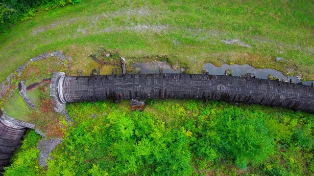 Summer aerial view featuring the 3.4 mile long wooden penstock in Vermont known as The Snake that runs from the Searsburg Dam to a generating station along the Deerfield River with an 8 foot diameter