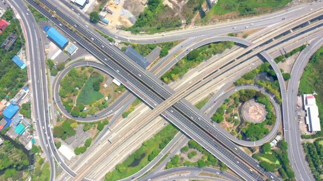 Aerial top View of busy freeway, rush hour heavy traffic jam highway. Aerial view of multiple roads in city, vehicular intersection, expressway with important infrastructure in the morning.