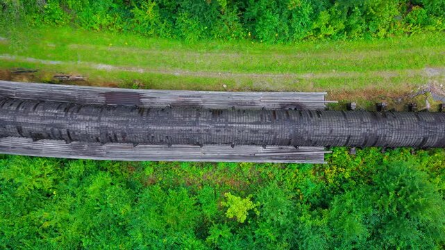 Summer aerial view featuring the 3.4 mile long wooden penstock in Vermont known as The Snake that runs from the Searsburg Dam to a generating station along the Deerfield River with an 8 foot diameter