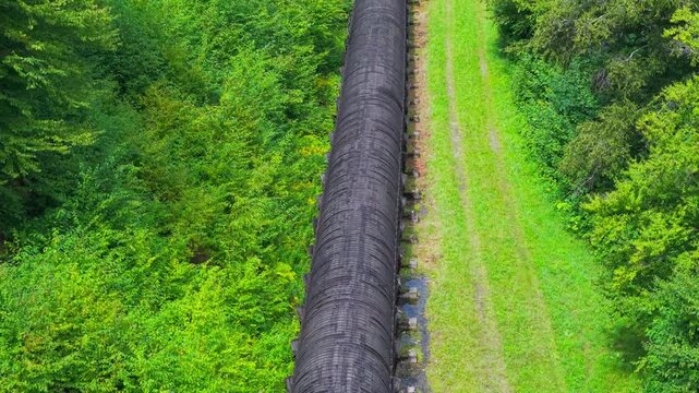 Summer aerial view featuring the 3.4 mile long wooden penstock in Vermont known as The Snake that runs from the Searsburg Dam to a generating station along the Deerfield River with an 8 foot diameter