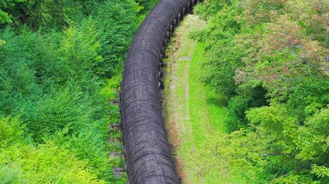 Summer aerial view featuring the 3.4 mile long wooden penstock in Vermont known as The Snake that runs from the Searsburg Dam to a generating station along the Deerfield River with an 8 foot diameter