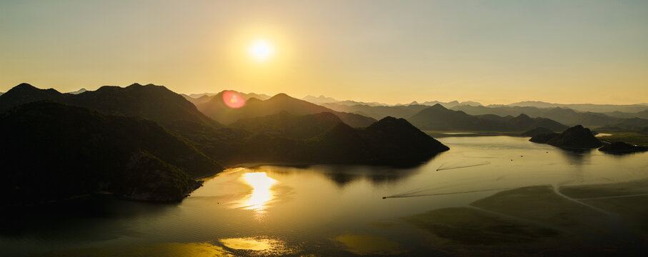Aerial Sunset Over Lake Skadar and Montenegro Mountains