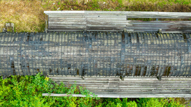 Summer aerial view featuring the 3.4 mile long wooden penstock in Vermont known as The Snake that runs from the Searsburg Dam to a generating station along the Deerfield River with an 8 foot diameter