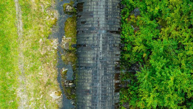 Summer aerial view featuring the 3.4 mile long wooden penstock in Vermont known as The Snake that runs from the Searsburg Dam to a generating station along the Deerfield River with an 8 foot diameter