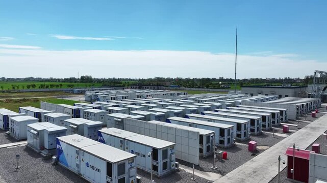 large outdoor energy storage station battery container array under blue sky